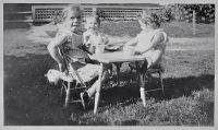 Photo of Edward Patrick Dunn with sisters in side yard at 10 Dayton Street in Augusta, Maine.